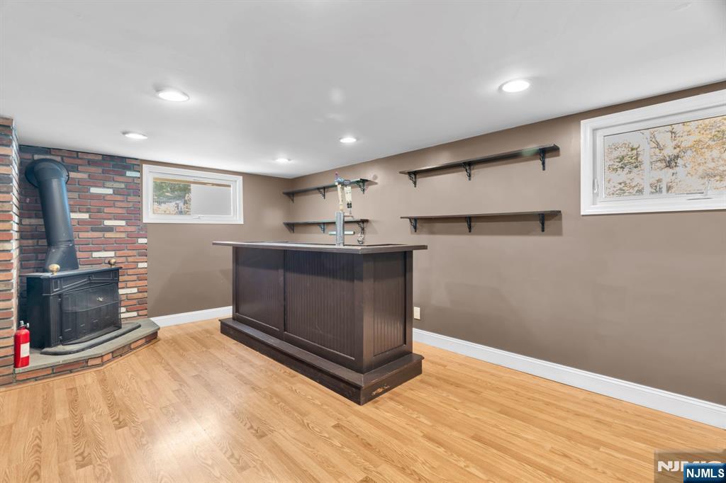 53 Smithfield Road Waldwick, NJ 07463 - Photo 14 of 48 a room with stainless steel appliances kitchen island granite countertop a refrigerator and a stove top oven
