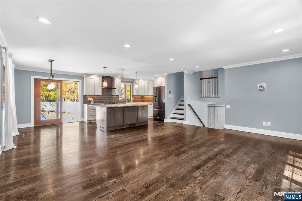 53 Smithfield Road Waldwick, NJ 07463 - Photo 18 of 48 a view of kitchen with kitchen island microwave and wooden floor