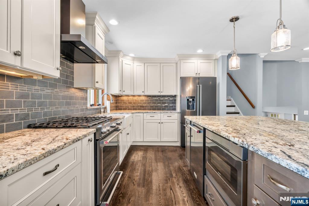 53 Smithfield Road Waldwick, NJ 07463 - Photo 20 of 48 a kitchen with a sink stove and refrigerator
