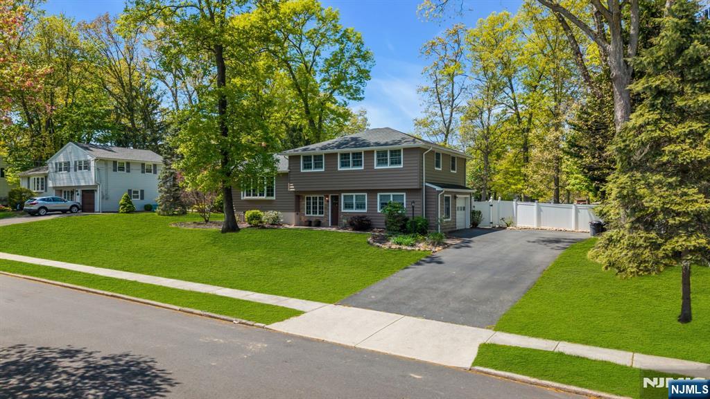53 Smithfield Road Waldwick, NJ 07463 - Photo 2 of 48 a front view of a house with a yard and porch