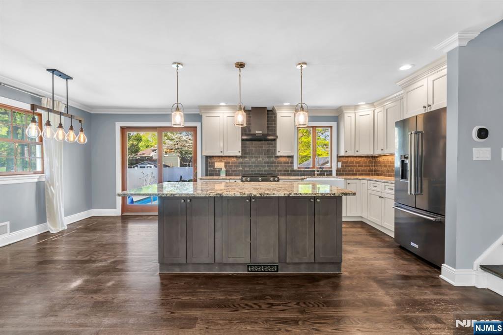 53 Smithfield Road Waldwick, NJ 07463 - Photo 22 of 48 a kitchen with wooden floors and refrigerator