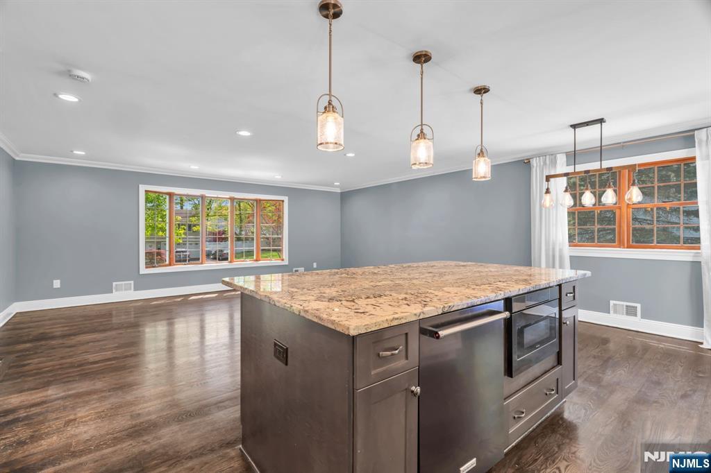 53 Smithfield Road Waldwick, NJ 07463 - Photo 23 of 48 a kitchen with a stove a sink a window and wooden floor
