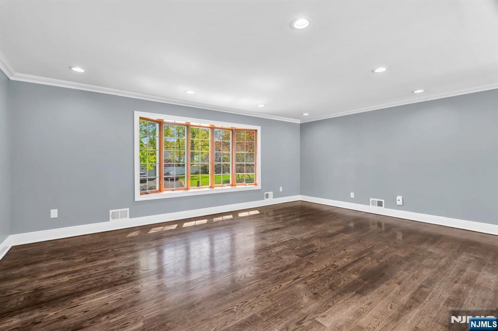 53 Smithfield Road Waldwick, NJ 07463 - Photo 24 of 48 an empty room with wooden floor and windows
