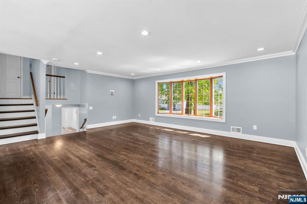 53 Smithfield Road Waldwick, NJ 07463 - Photo 25 of 48 a view of an empty room with wooden floor and a window