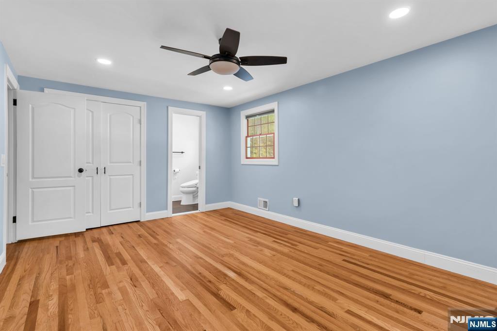 53 Smithfield Road Waldwick, NJ 07463 - Photo 30 of 48 a view of empty room with wooden floor and fan