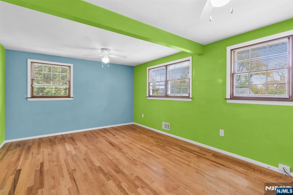53 Smithfield Road Waldwick, NJ 07463 - Photo 33 of 48 a view of empty room with window and wooden floor