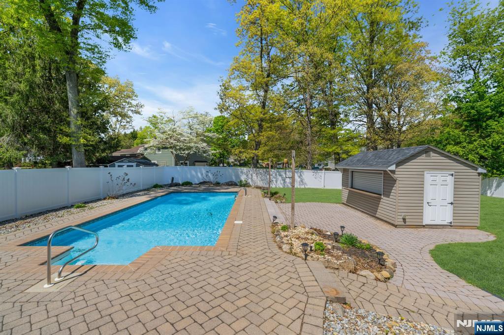 53 Smithfield Road Waldwick, NJ 07463 - Photo 35 of 48 a view of a backyard with swimming pool