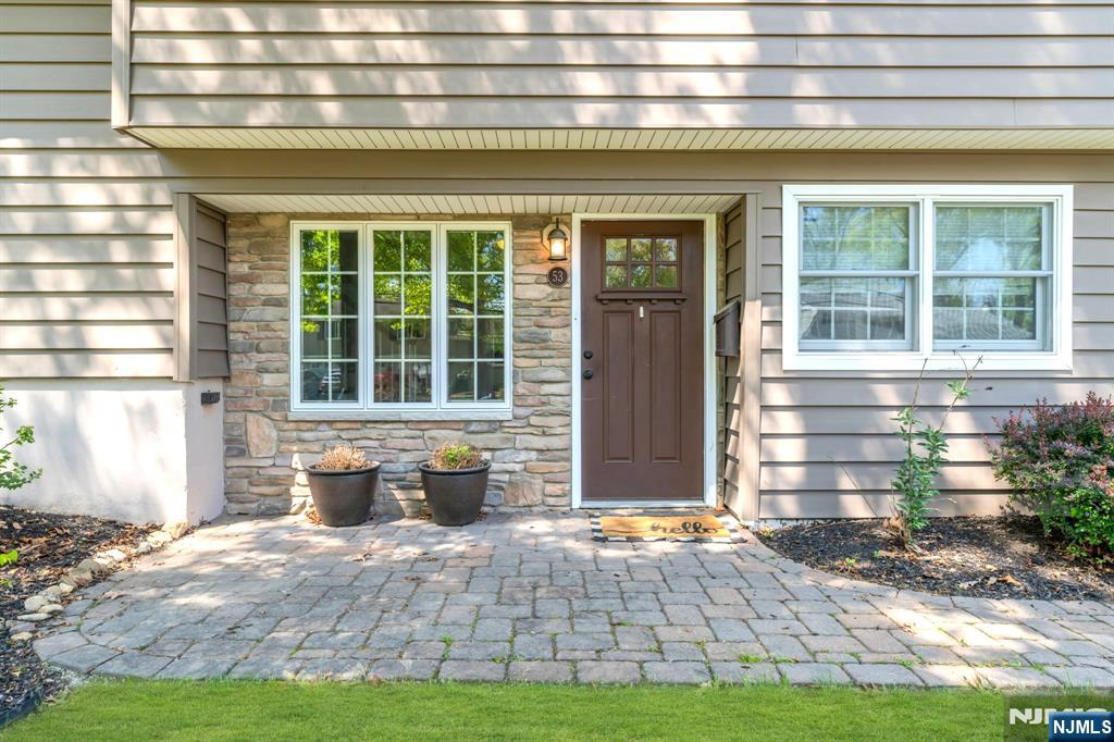 53 Smithfield Road Waldwick, NJ 07463 - Photo 5 of 48 a front view of a house with a yard