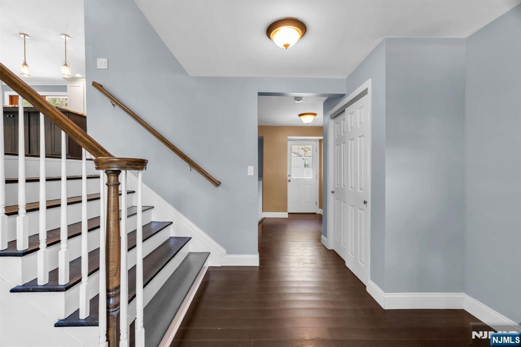 53 Smithfield Road Waldwick, NJ 07463 - Photo 7 of 48 a view of a hallway with wooden floor and staircase