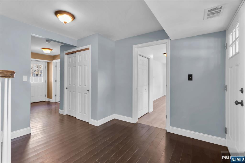 53 Smithfield Road Waldwick, NJ 07463 - Photo 8 of 48 an empty room with wooden floor and windows