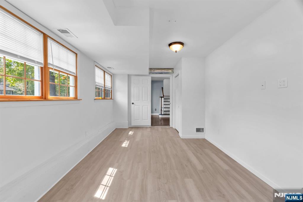 53 Smithfield Road Waldwick, NJ 07463 - Photo 10 of 48 wooden floor in an empty room with a window