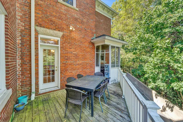 a bathroom with a toilet a sink and a large mirror