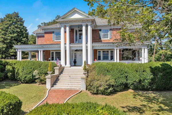 a view of a chairs and table in the patio