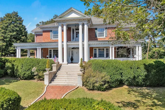 a view of a chairs and table in the patio