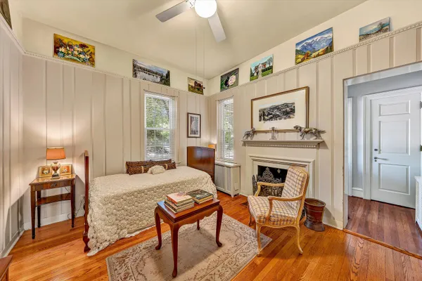a bedroom with a bed and a table in it