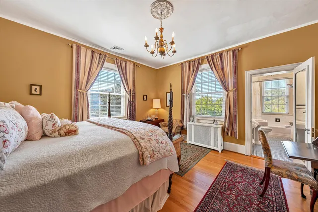 an aerial view of a house with a yard and swimming pool