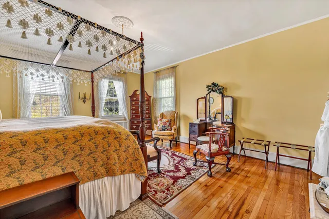 a view of a chairs and table in the balcony