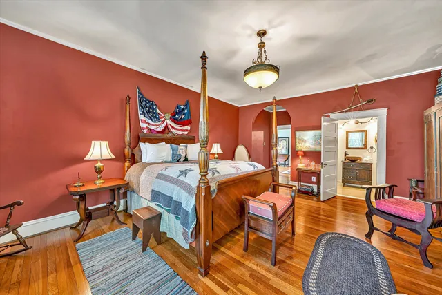 a bed room with bed and a flat screen tv