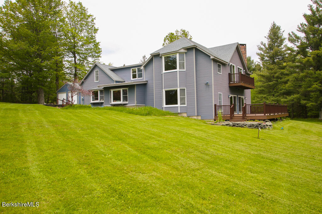 1271 Main Road Savoy, MA 01256 - Photo 6 of 38 a view of a house with pool and a yard