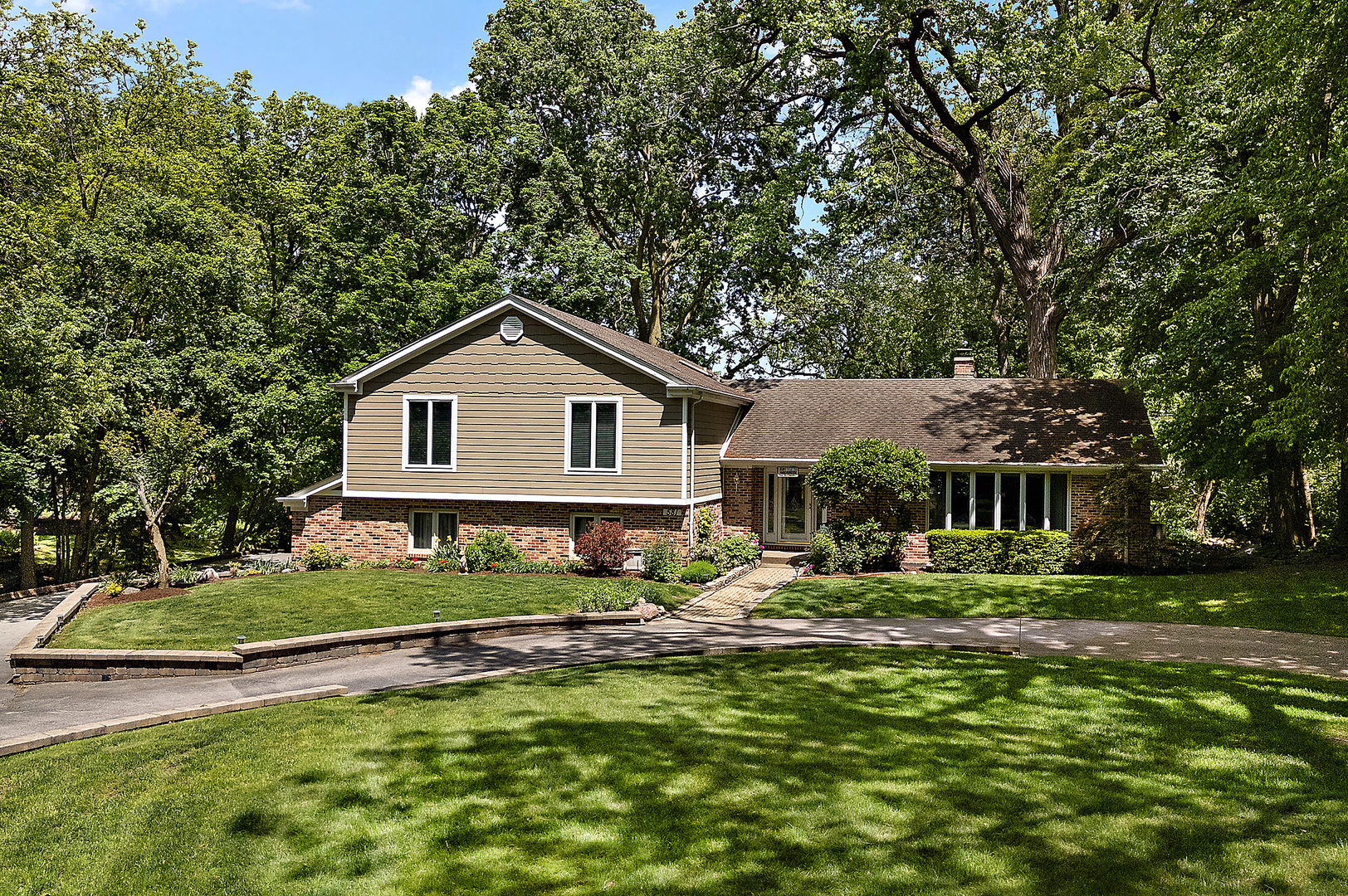 581 Aberdeen Road Frankfort, IL 60423 - Photo 1 of 65 a front view of a house with a yard table and chairs