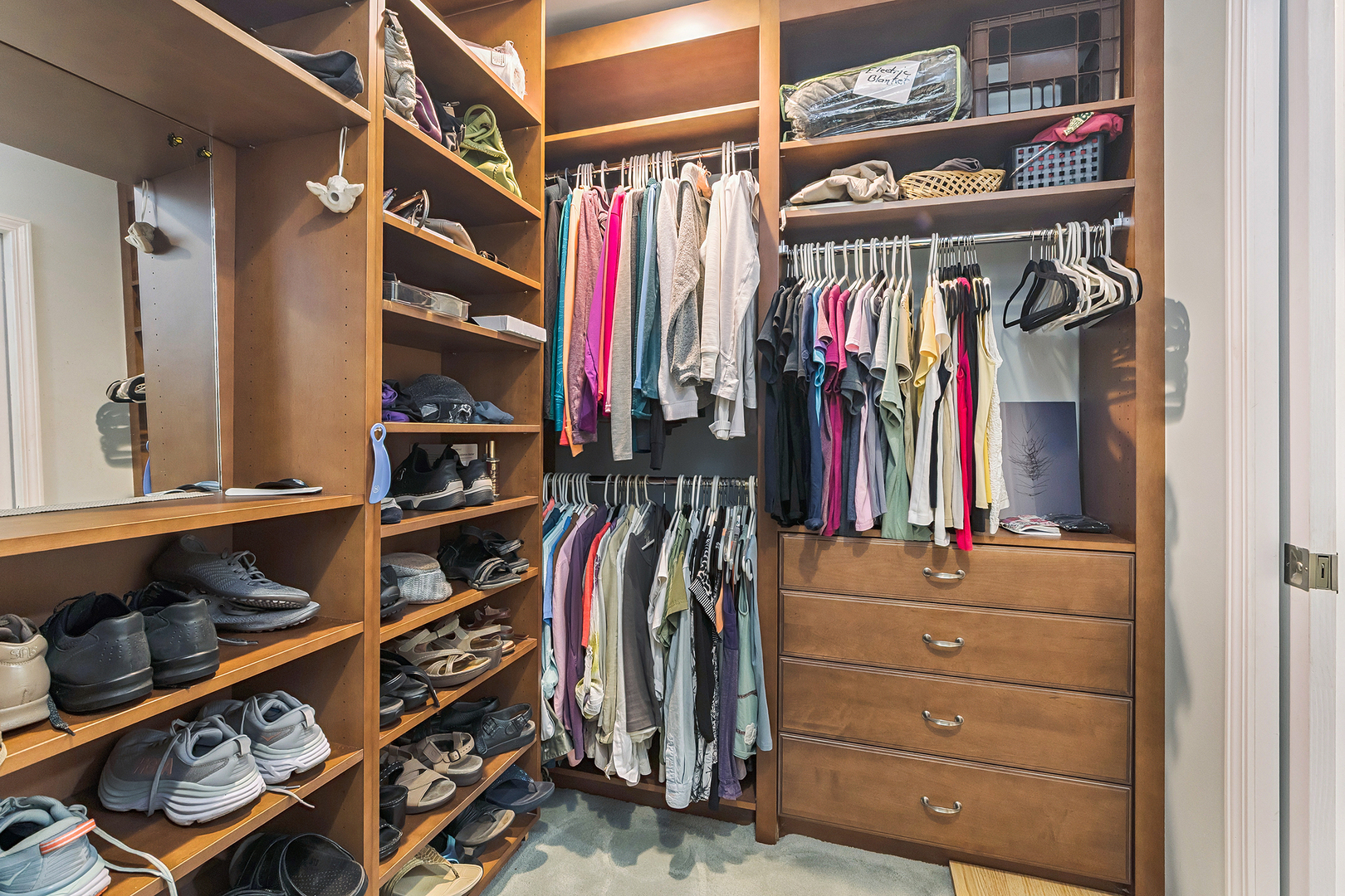 581 Aberdeen Road Frankfort, IL 60423 - Photo 29 of 65 a view of walk in closet with clothes and shoes