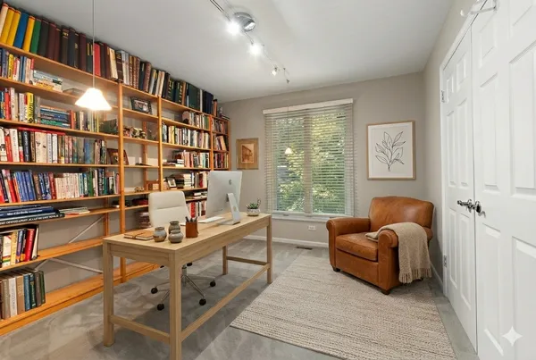 a view of table and chair under an umbrella
