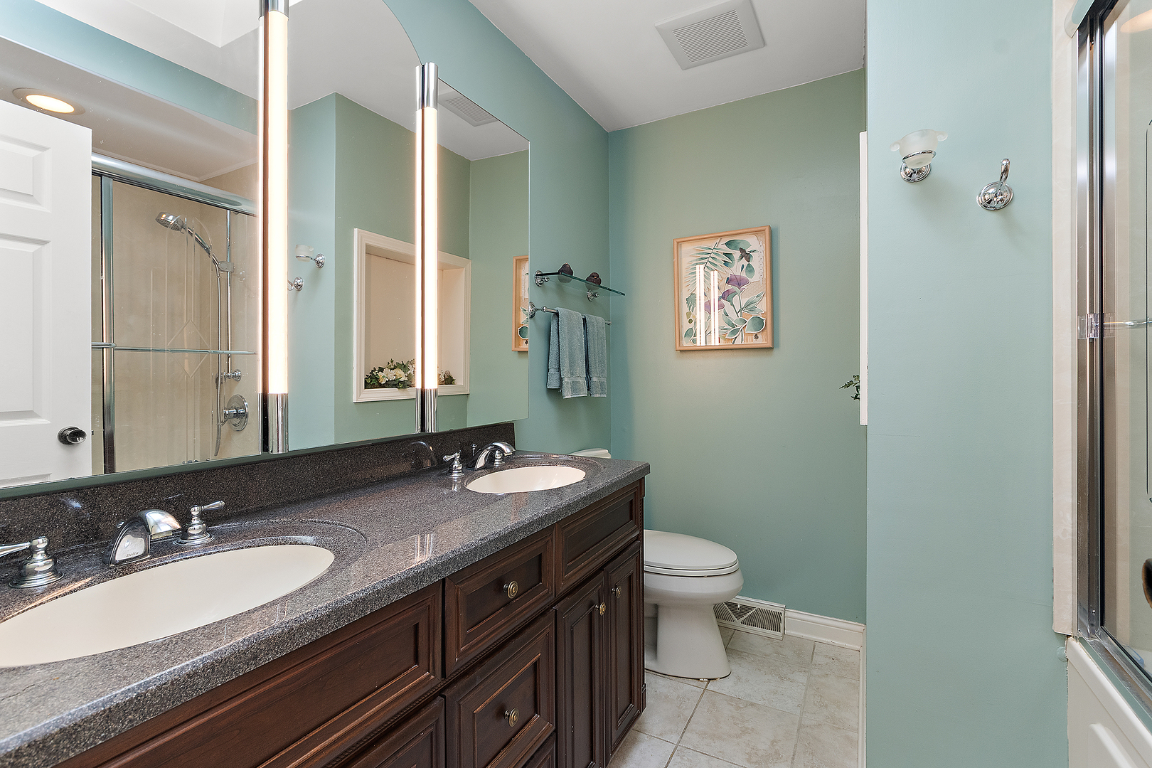 581 Aberdeen Road Frankfort, IL 60423 - Photo 32 of 65 a bathroom with a double vanity sink toilet and a mirror