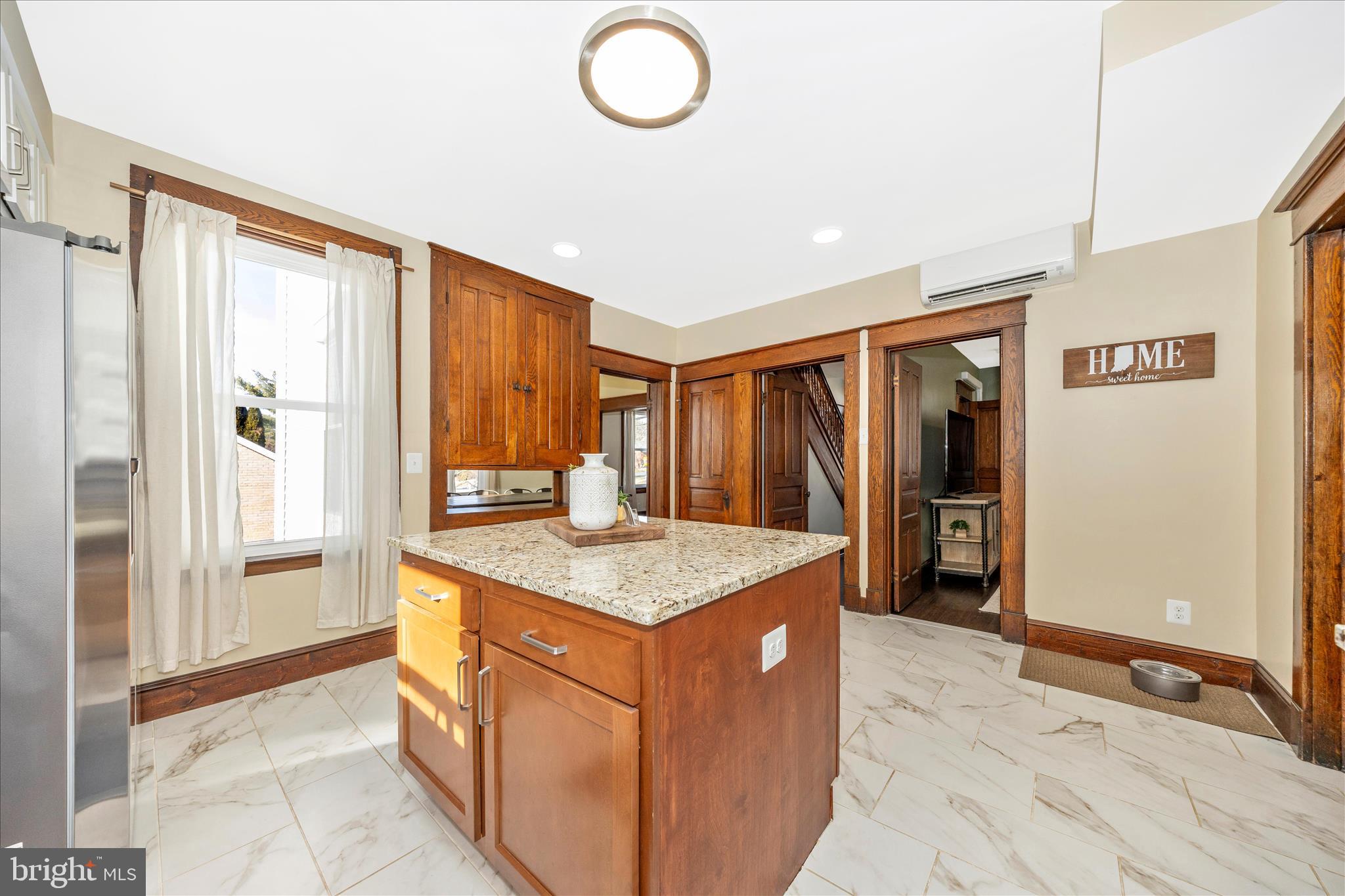 706 East Main Street Middletown, MD 21769 - Photo 16 of 63 a kitchen with stainless steel appliances granite countertop a refrigerator and a sink