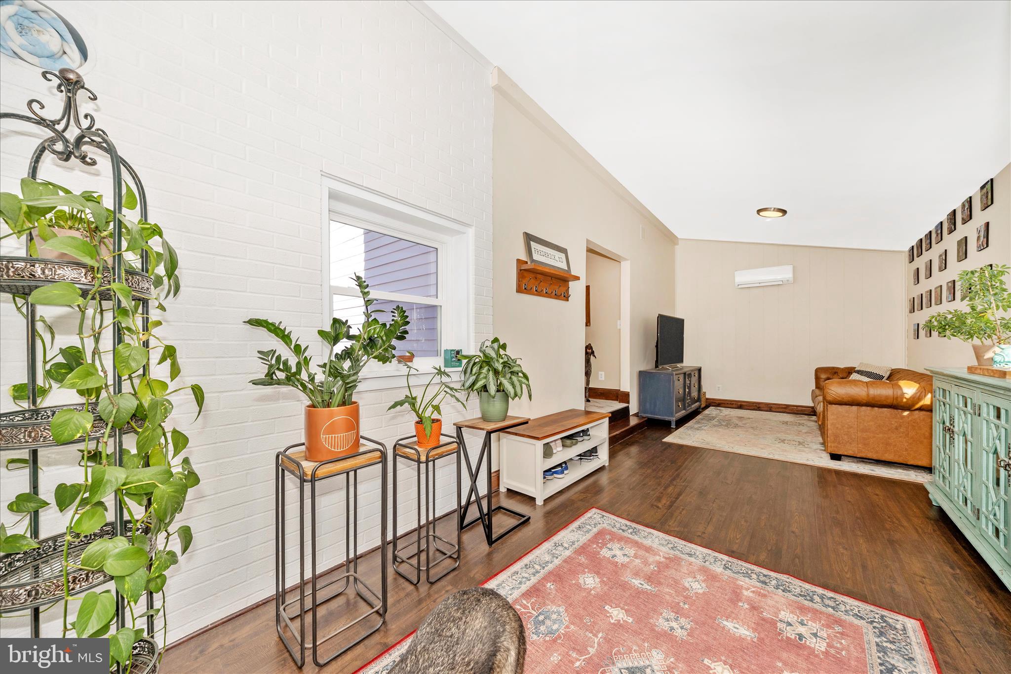 706 East Main Street Middletown, MD 21769 - Photo 20 of 63 a living room with furniture and a potted plant