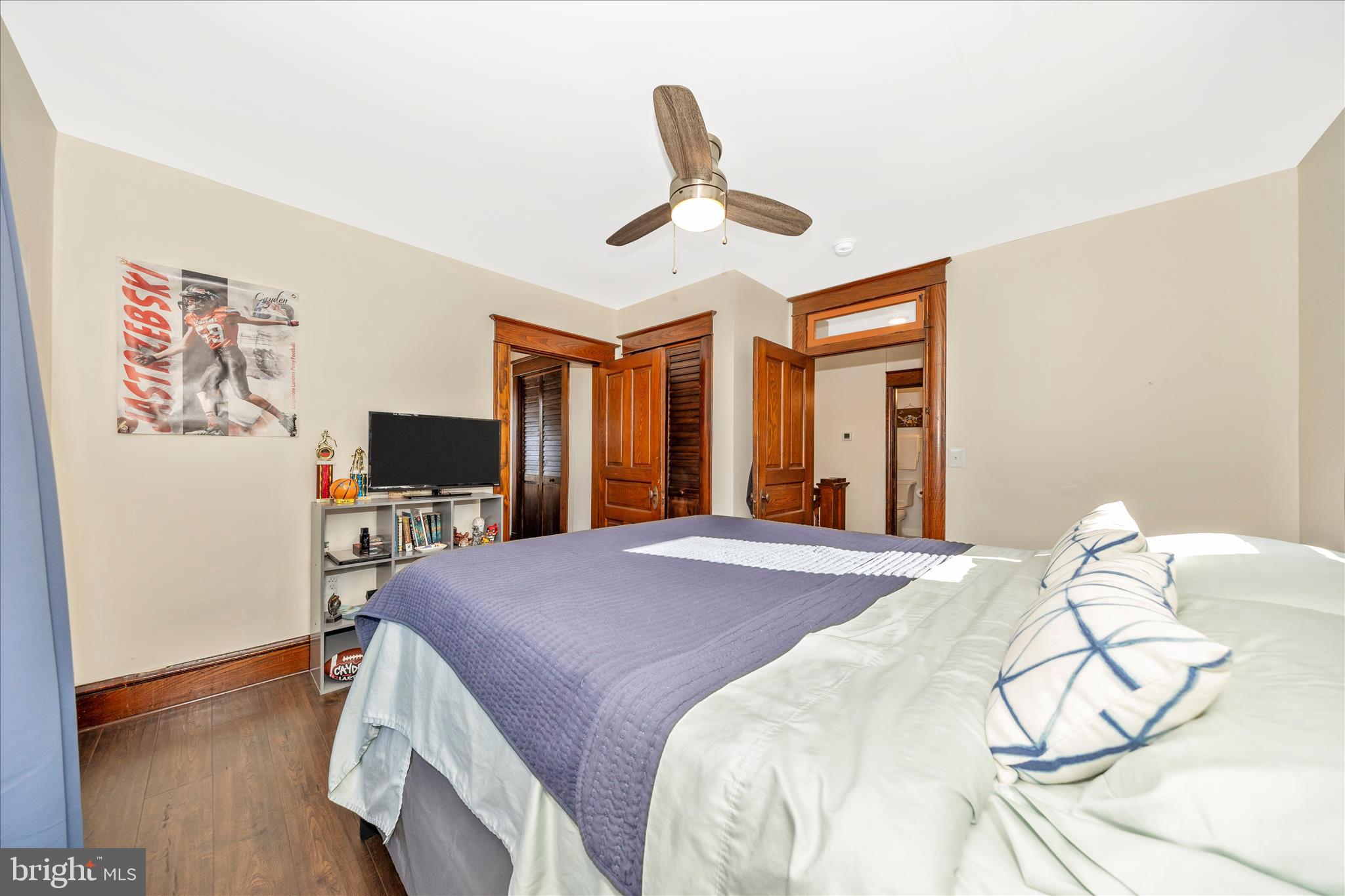 706 East Main Street Middletown, MD 21769 - Photo 27 of 63 a bedroom with a bed and a flat screen tv