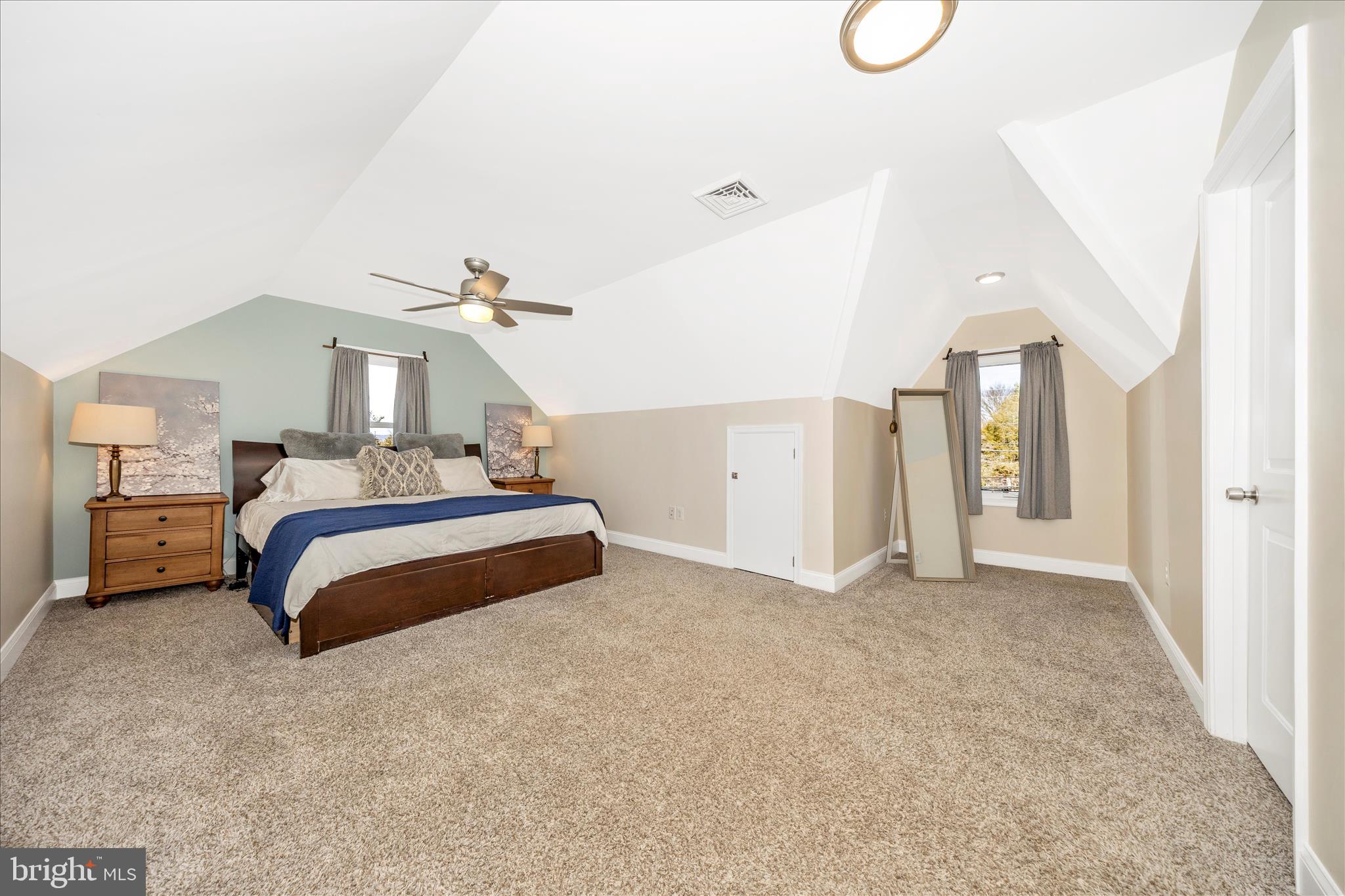 706 East Main Street Middletown, MD 21769 - Photo 34 of 63 a spacious bedroom with a bed and a cabinets