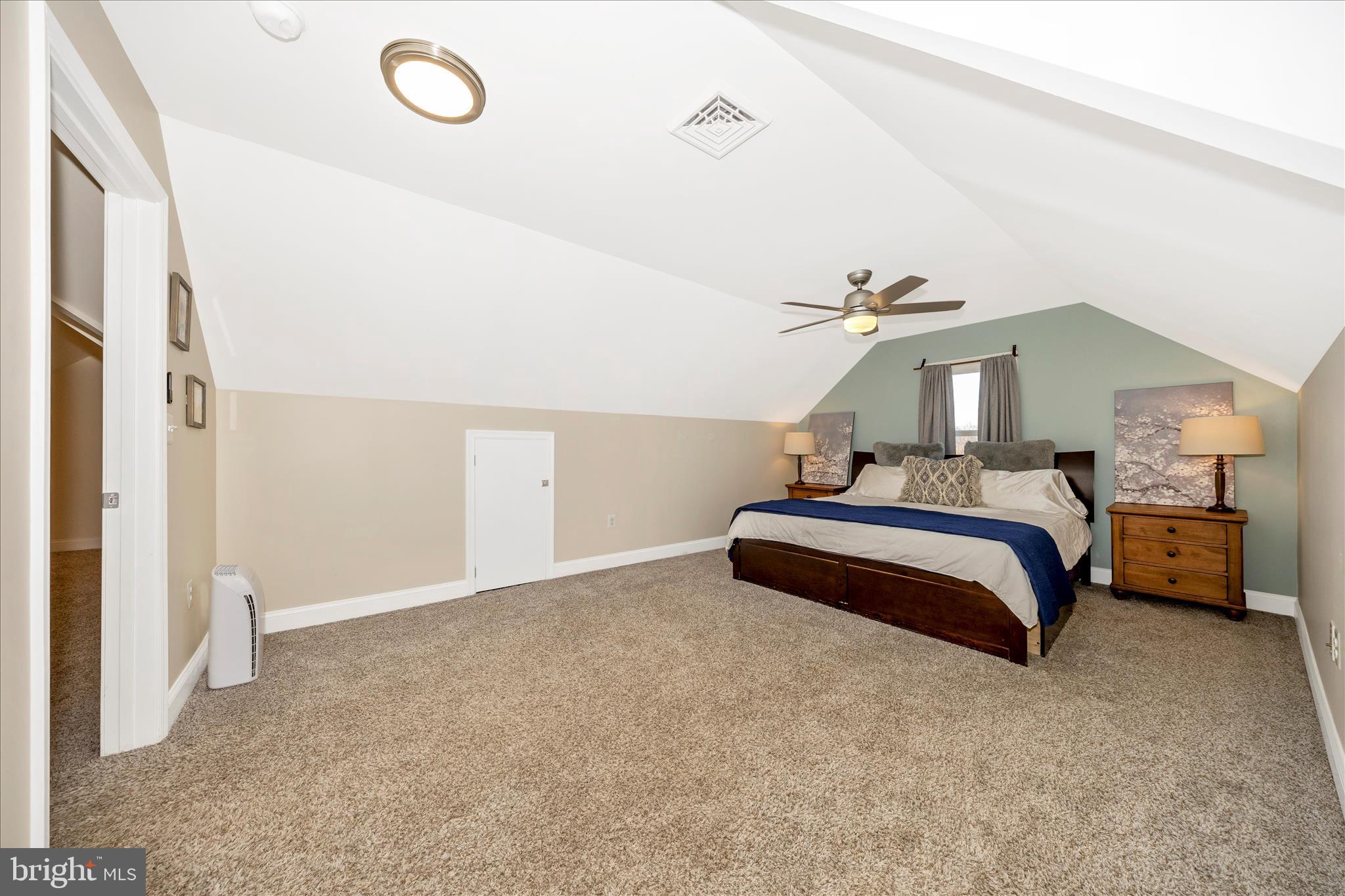 706 East Main Street Middletown, MD 21769 - Photo 35 of 63 a bedroom with a bed and a chandelier