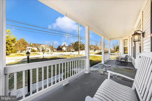 a view of a lounge chairs in the back yard of the house
