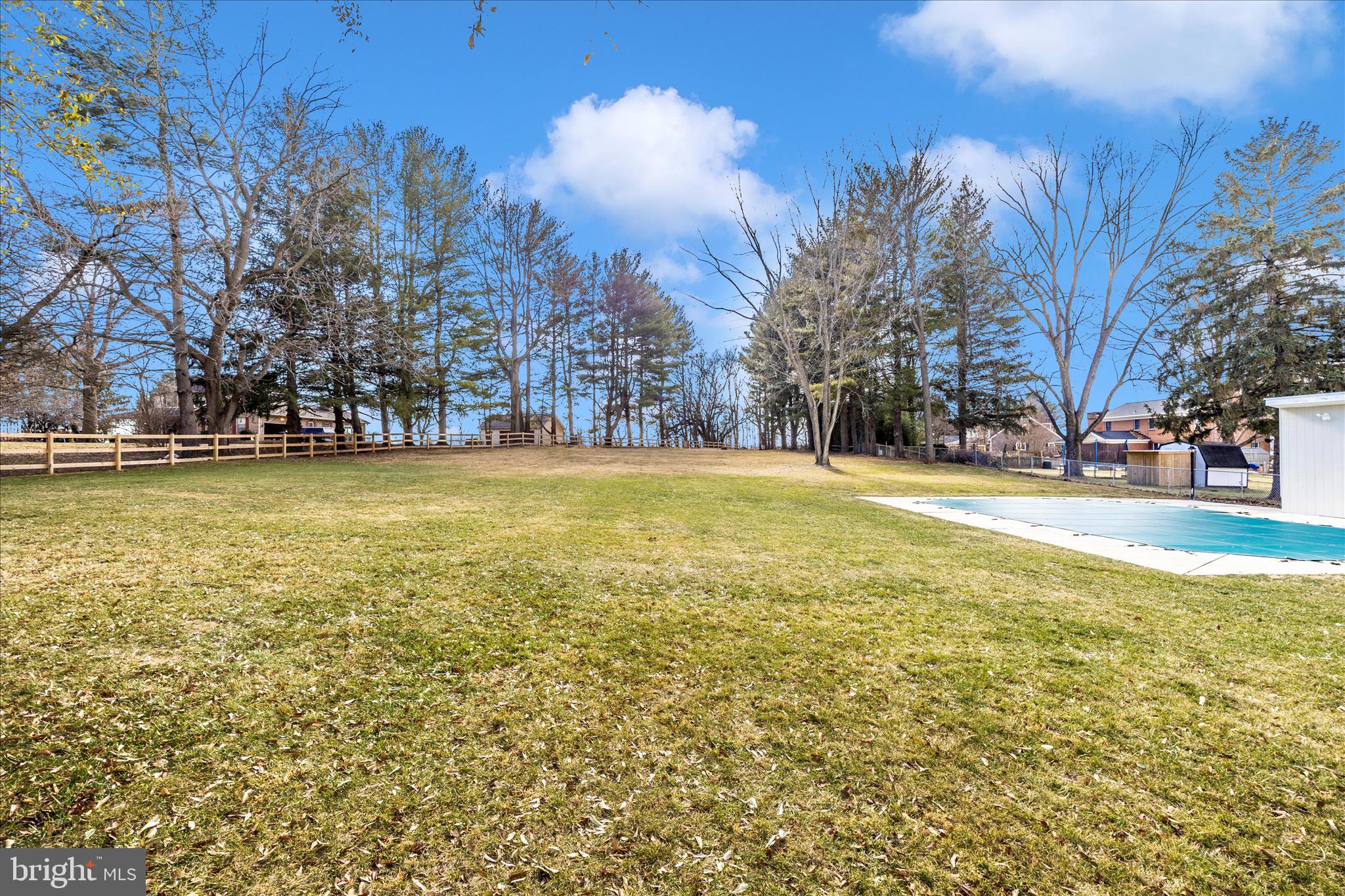 706 East Main Street Middletown, MD 21769 - Photo 50 of 63 a view of a swimming pool and trees in the background