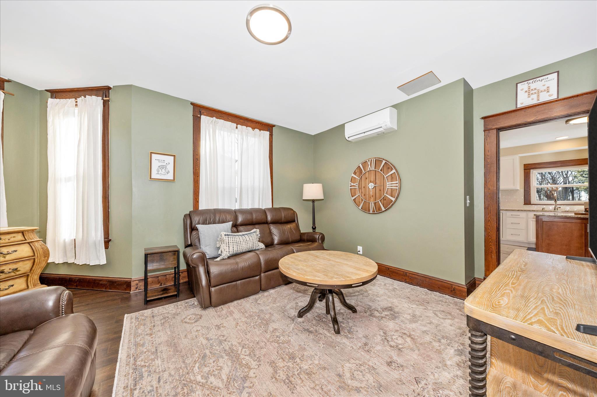 706 East Main Street Middletown, MD 21769 - Photo 6 of 63 a living room with furniture a window and a table