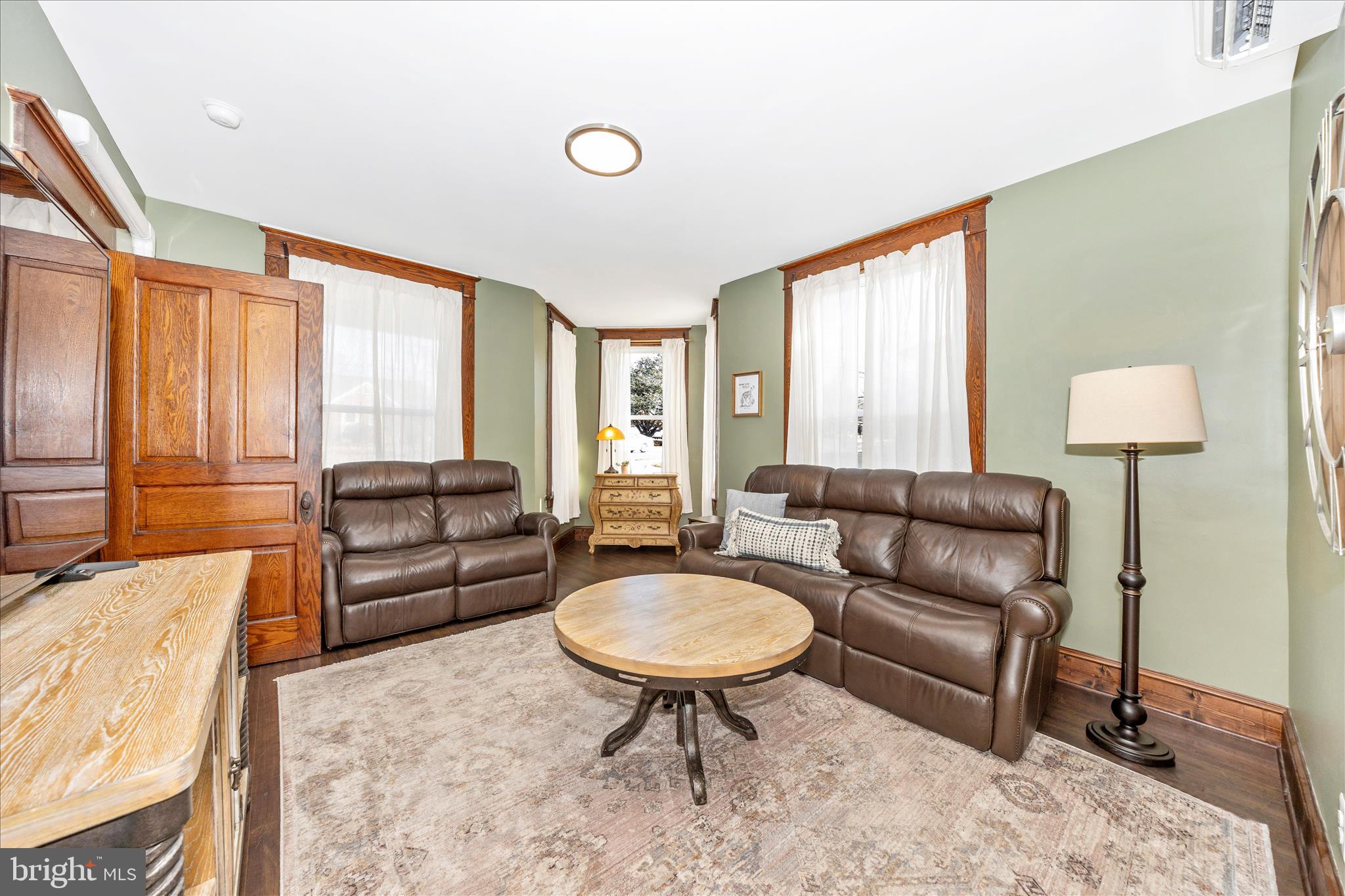 706 East Main Street Middletown, MD 21769 - Photo 9 of 63 a living room with furniture and a large window
