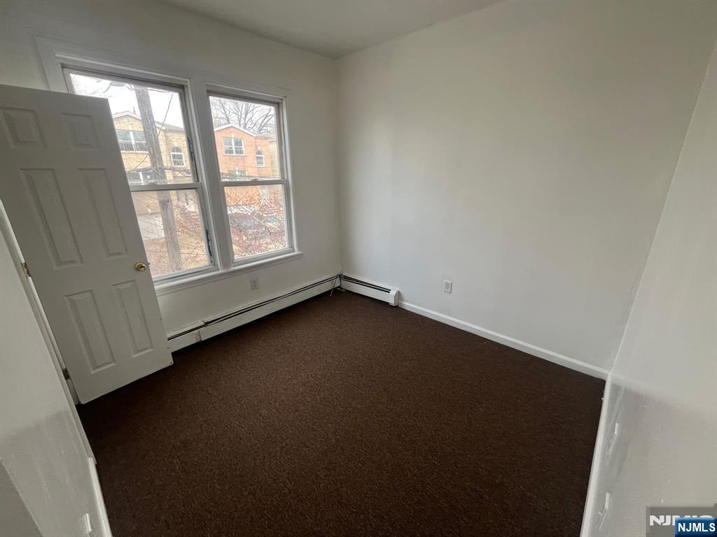 288 South 6th Street, Unit 2 Newark, NJ 07103 - Photo 3 of 5 an empty room with a window
