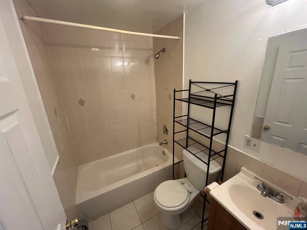 288 South 6th Street, Unit 2 Newark, NJ 07103 - Photo 4 of 5 a bathroom with a sink toilet and shower
