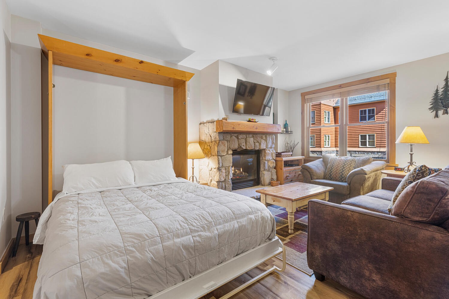 100 Dercum Square, Unit 8337 Keystone, CO 80435 - Photo 13 of 32 a spacious bedroom with a bed a couch and dresser with wooden floor