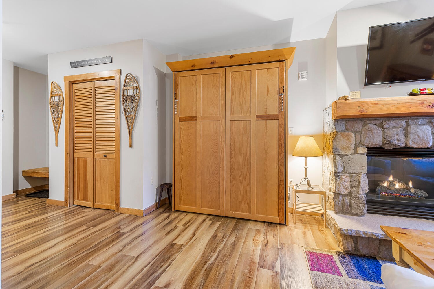 100 Dercum Square, Unit 8337 Keystone, CO 80435 - Photo 15 of 32 a view of a livingroom with wooden floor and a flat screen tv