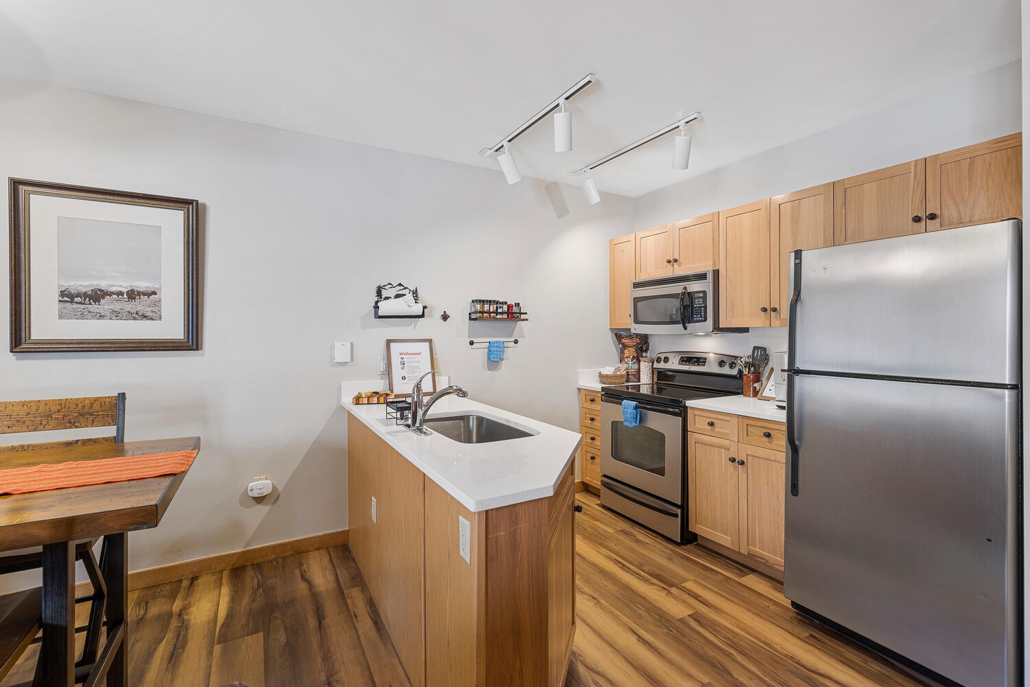 100 Dercum Square, Unit 8337 Keystone, CO 80435 - Photo 16 of 32 a kitchen with stainless steel appliances a refrigerator a sink a stove a dining table and chairs