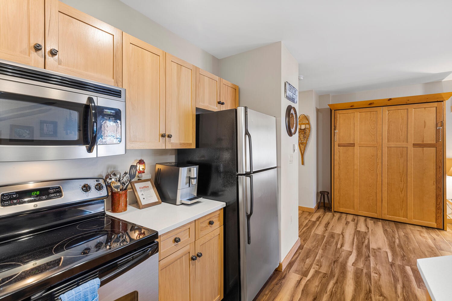 100 Dercum Square, Unit 8337 Keystone, CO 80435 - Photo 19 of 32 a kitchen with a refrigerator stove and microwave