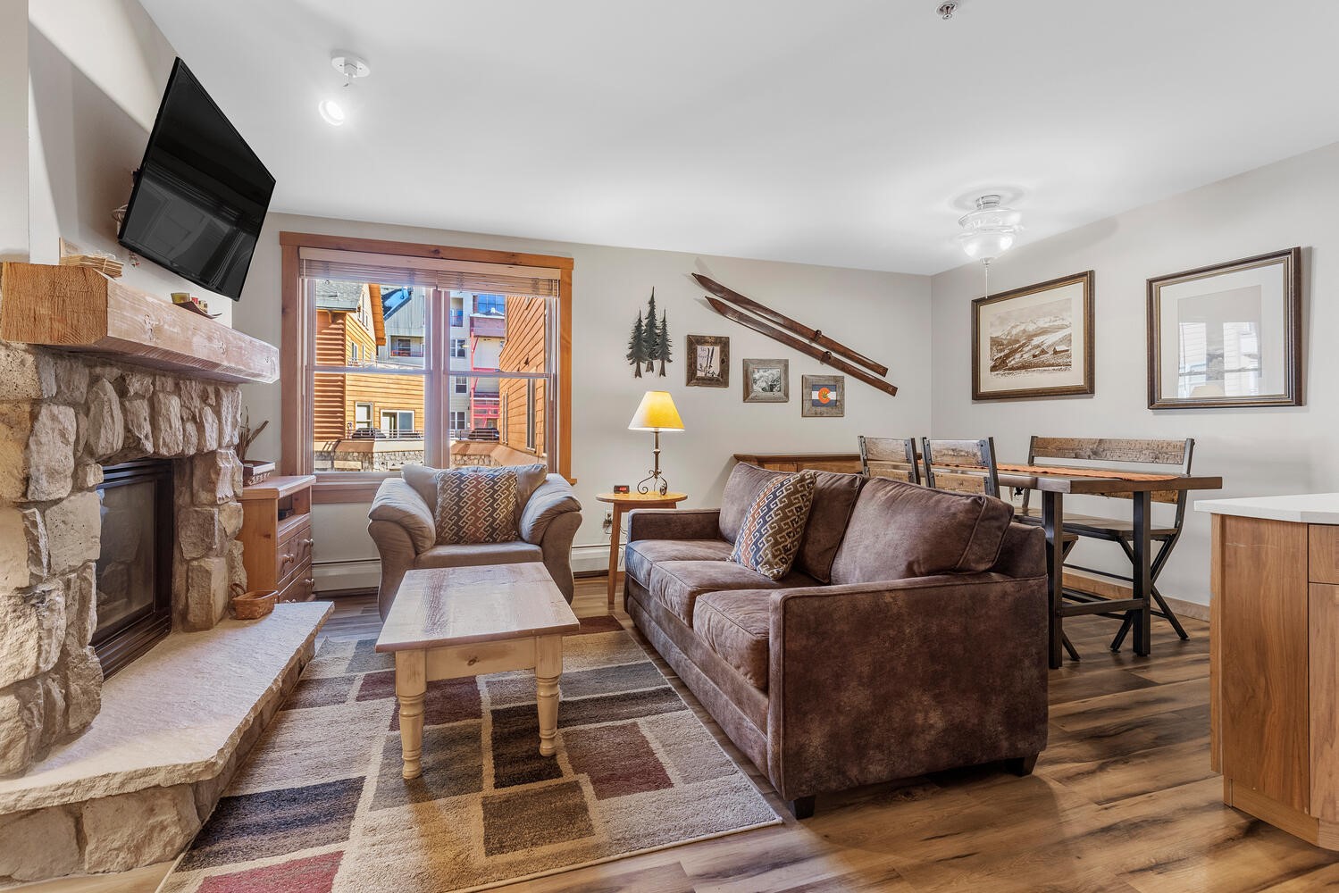 100 Dercum Square, Unit 8337 Keystone, CO 80435 - Photo 2 of 32 a living room with furniture a flat screen tv and a fireplace