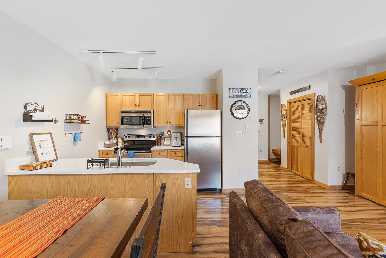 100 Dercum Square, Unit 8337 Keystone, CO 80435 - Photo 21 of 32 a kitchen with kitchen island granite countertop a sink cabinets and stainless steel appliances