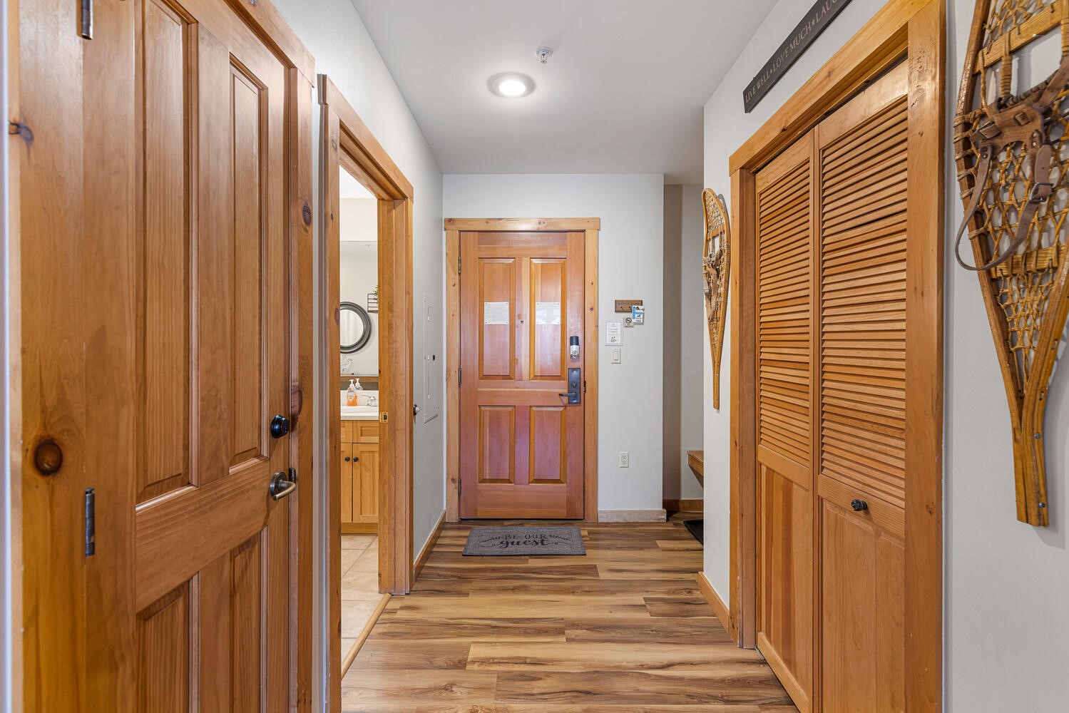 100 Dercum Square, Unit 8337 Keystone, CO 80435 - Photo 22 of 32 a view of a hallway with wooden floor and a bathroom