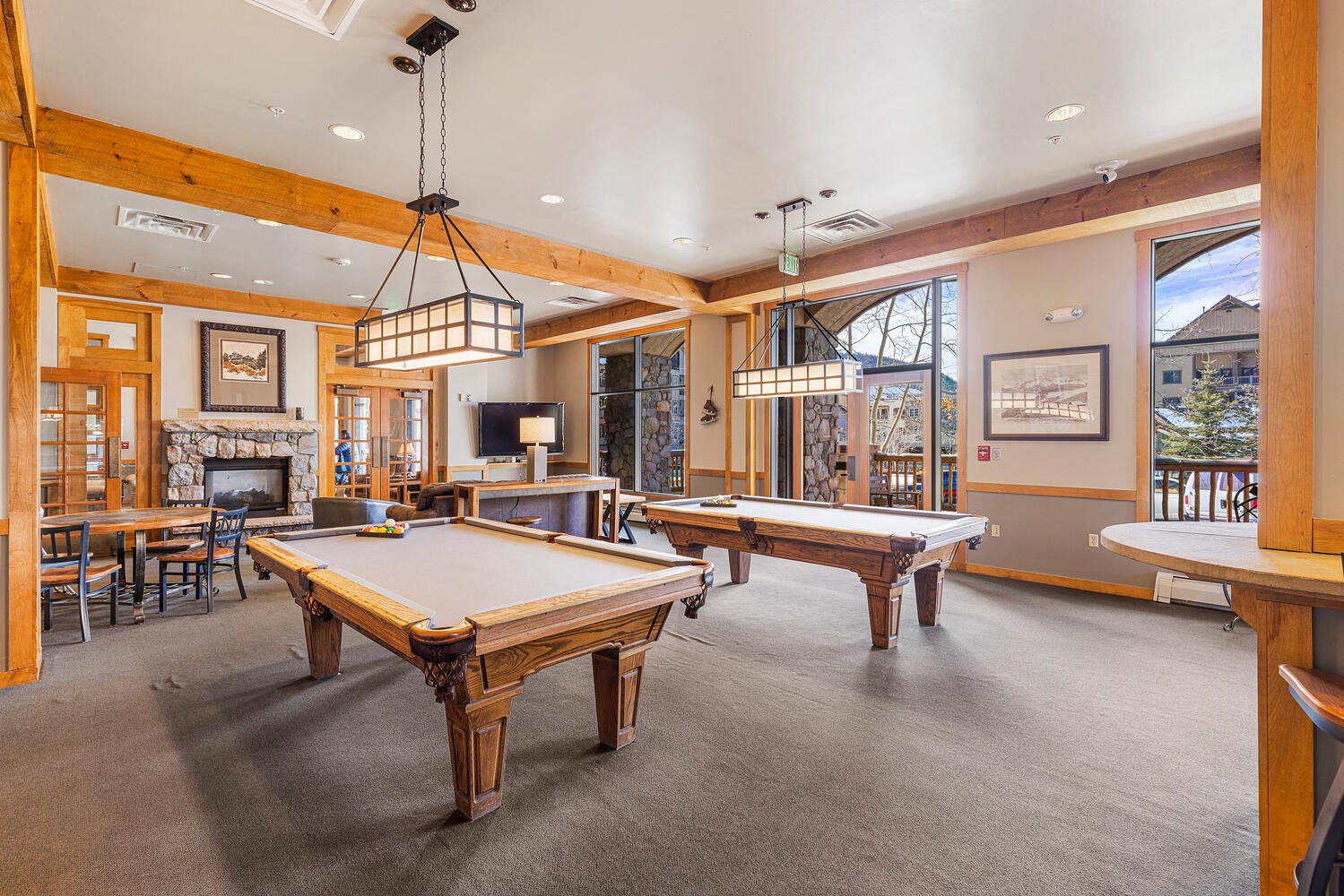 100 Dercum Square, Unit 8337 Keystone, CO 80435 - Photo 29 of 32 a room with lots of tables a large window and chairs