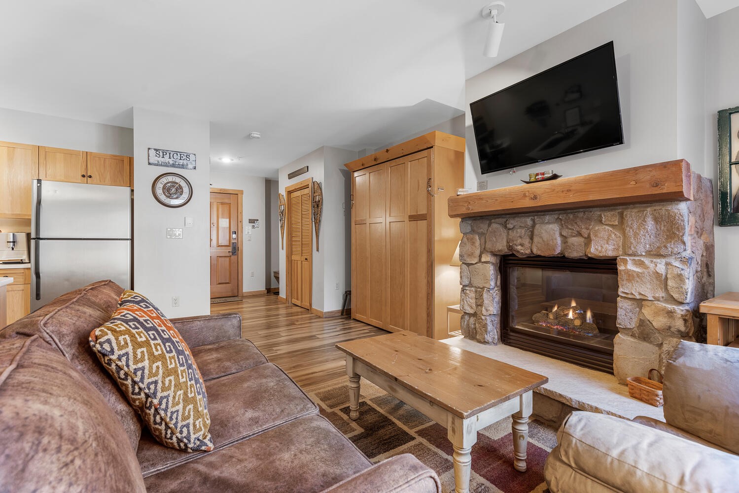 100 Dercum Square, Unit 8337 Keystone, CO 80435 - Photo 4 of 32 a living room with a flat screen tv and a fireplace