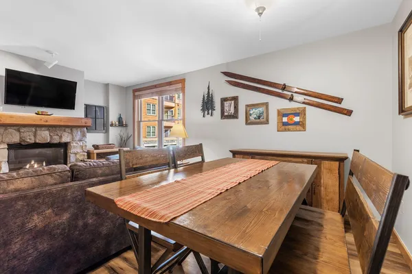 a view of a dining room with furniture window and wooden floor