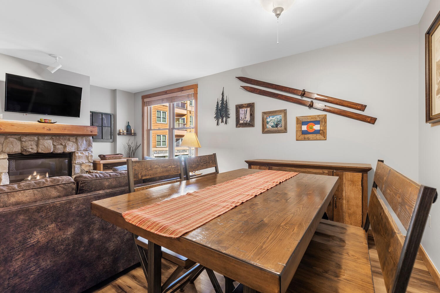 100 Dercum Square, Unit 8337 Keystone, CO 80435 - Photo 7 of 32 a living room with furniture a flat screen tv and a fireplace