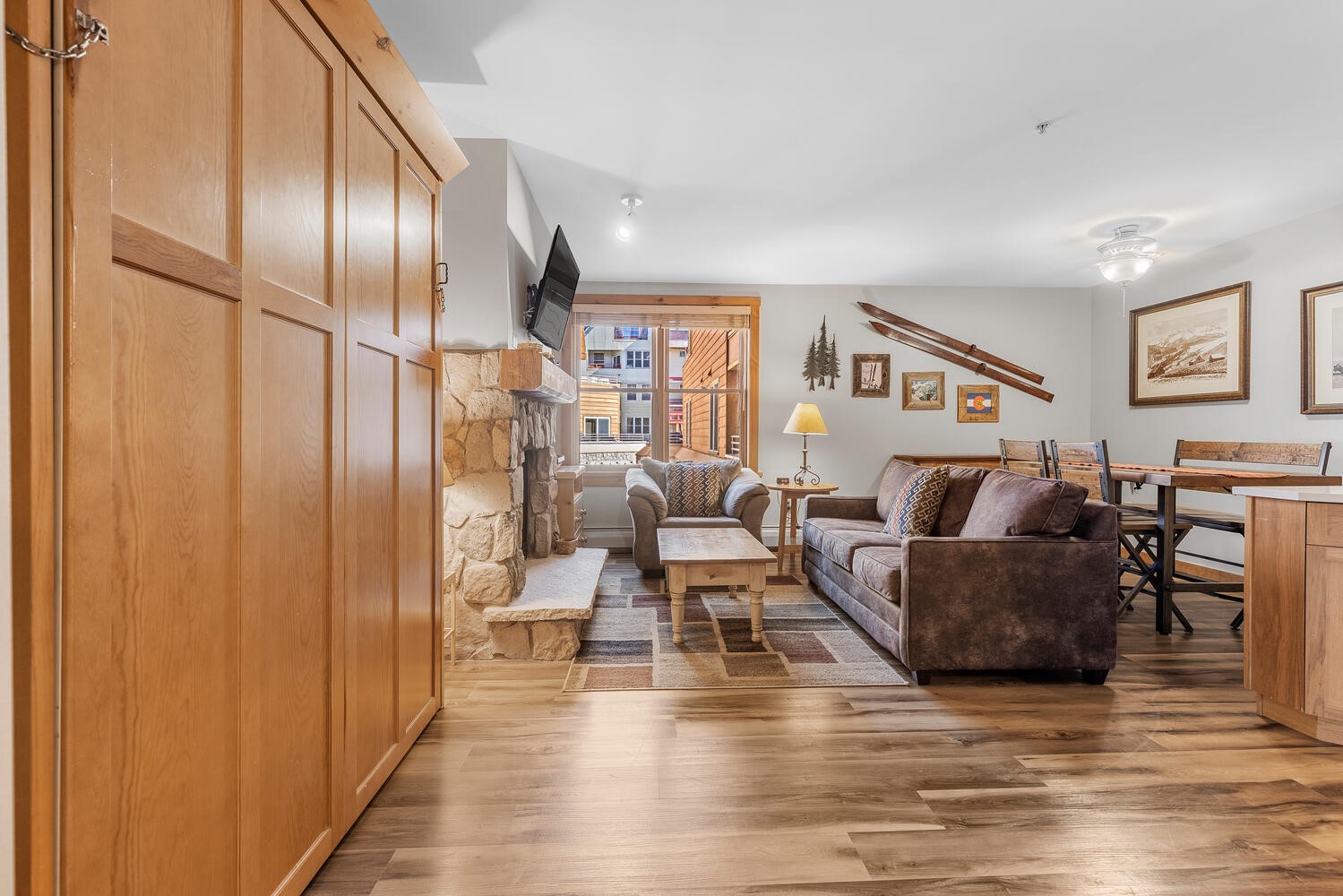 100 Dercum Square, Unit 8337 Keystone, CO 80435 - Photo 10 of 32 a living room with furniture wooden floor and a refrigerator